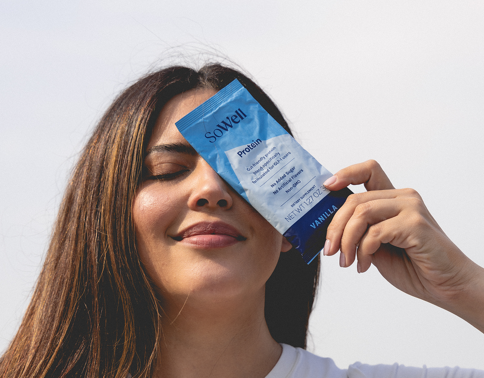 Woman holding a SoWell packet