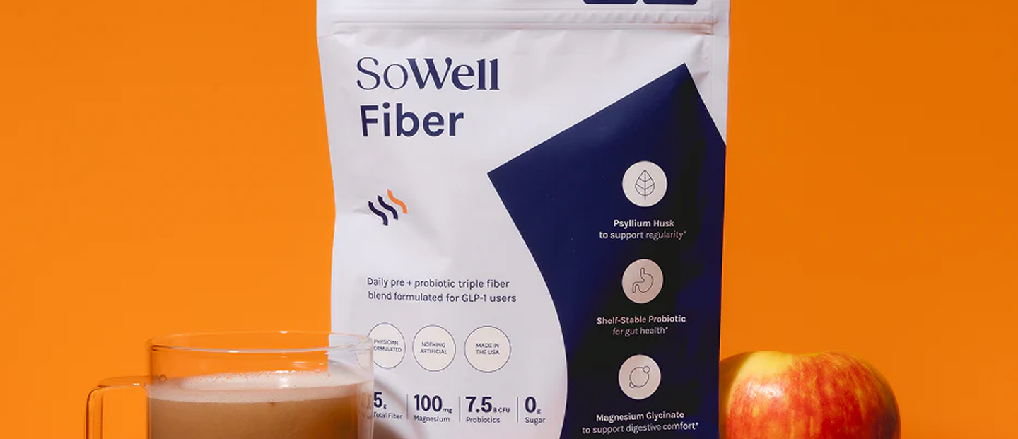 SoWell product held in hand on an orange background